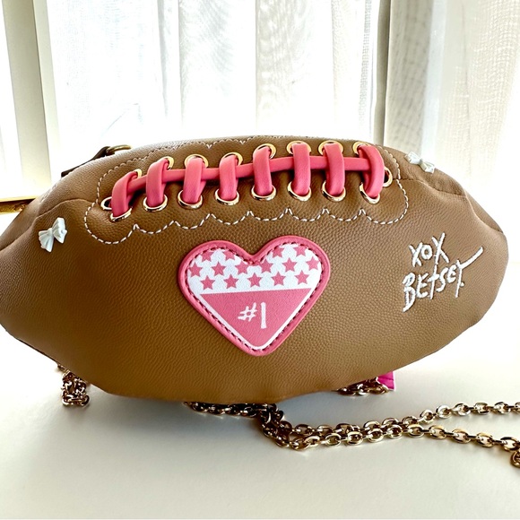 Betsey Johnson Handbags - Betsey Johnson FUN Tan Football Crossbody Bag with Pink Accents